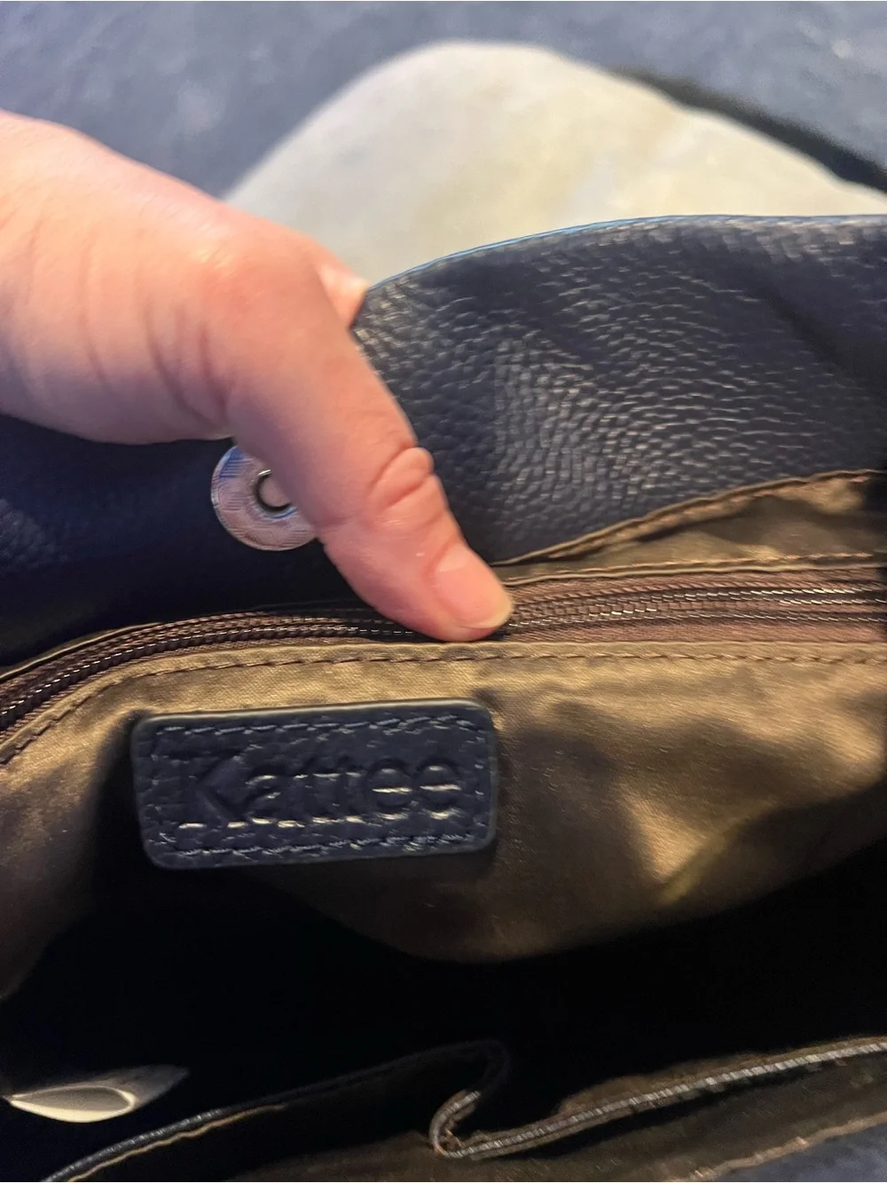 Elegant Black Leather Shoulder Bag with Front Zip Detail